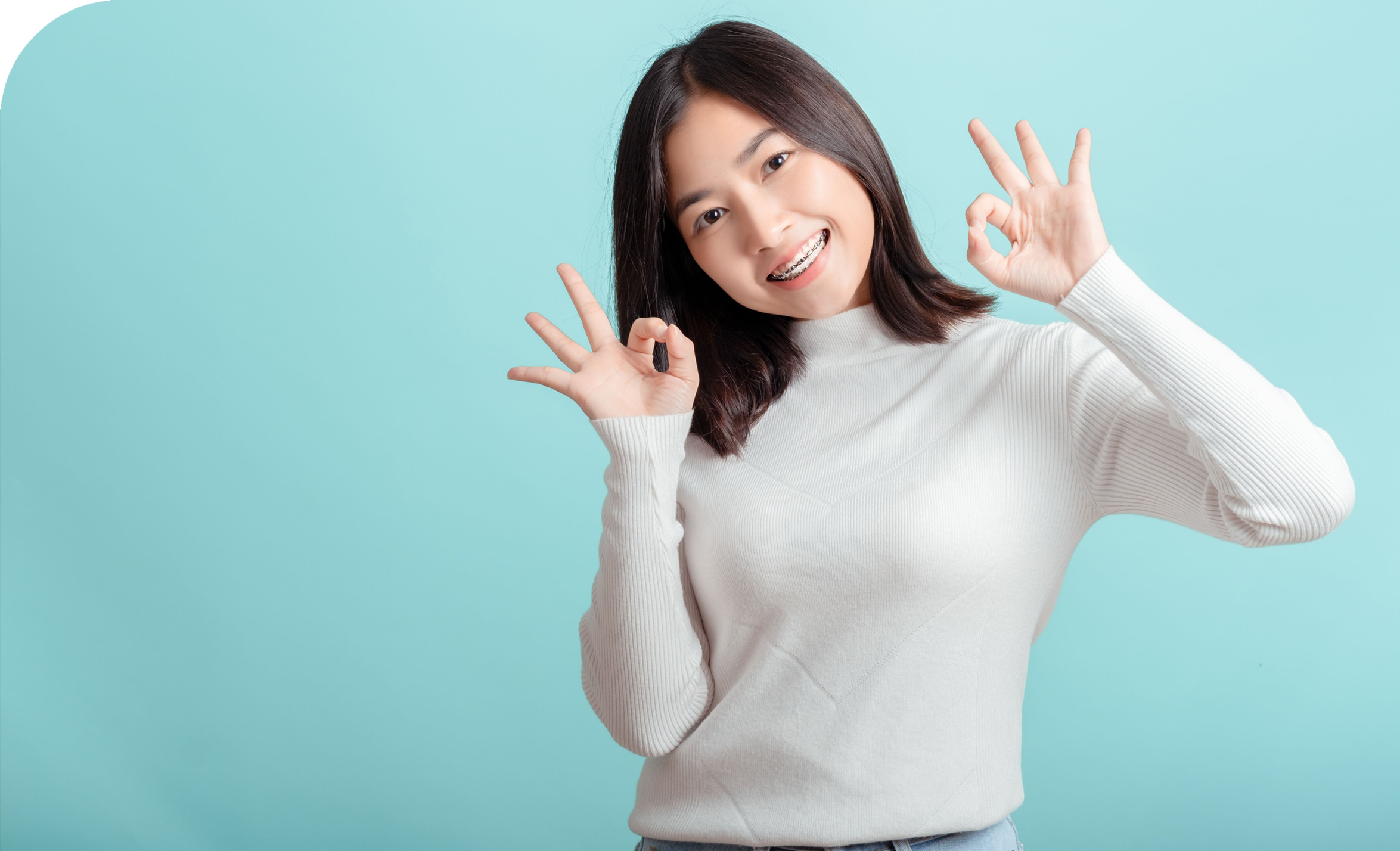 Girl with dental braces smiling with confidence